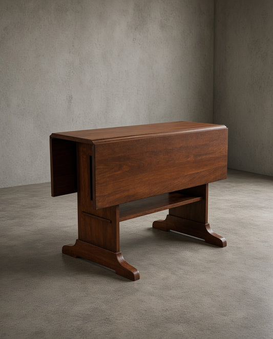 Mission Solid Oak Drop Leaf Dining Table - Walnut (W1), dark brown wood grain finish, on polished concrete floor with neutral wall background