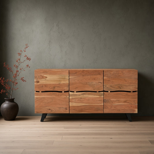 Natural Acacia Wood Live Edge Sideboard with three drawer units on wooden floor next to red plant in vase.