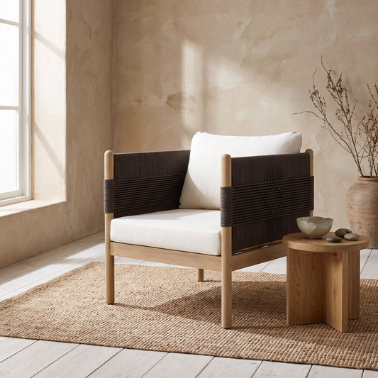 White cushion on teak wood chair with rope weave design, light teak finish.