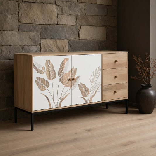 Wooden sideboard with plant designs, white and black natural mango wood finish, light wood cabinet with three drawers, brown vase with dried plants on a stone background, indoor setting