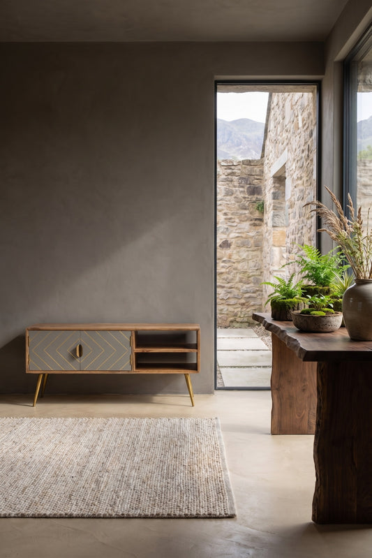 Sleek Cement Brass Inlay Media Unit with light wood finish and geometric grey inlays.