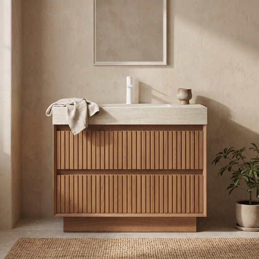 A modern wooden bathroom vanity with a light-colored counter and a sleek white sink, accented by a beige towel and a small vase.