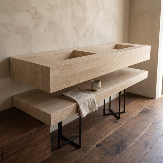 Rectangular brown travertine bathroom sink with matching shelf on metal stand, hanging towel, cup, rustic wood floor and wall
