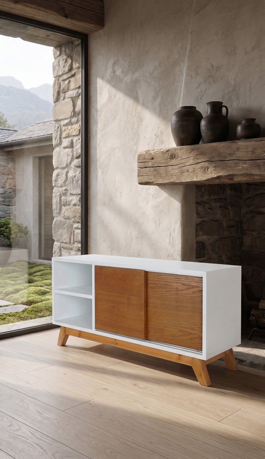 Modern TV cabinet with white top and wood side panels, placed on a wooden floor in a rustic interior setting with a wall-mounted shelf and stone accents.