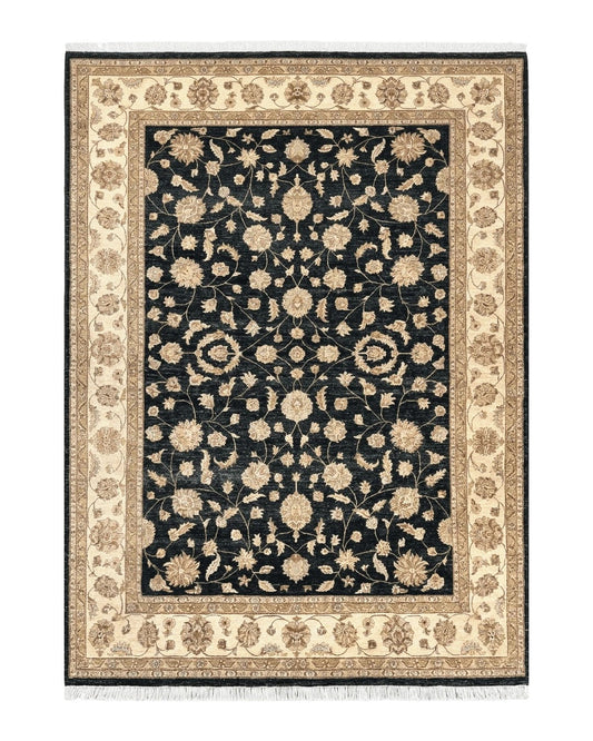 Vintage wool rug with black background and beige floral design, bordered by floral motifs.