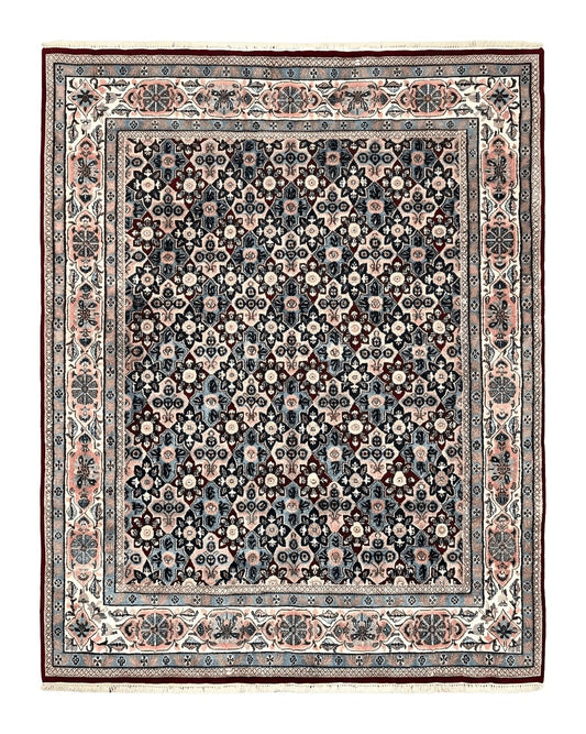 An 8x10 indoor/Persian rug with a repeated all-over pattern featuring navy blue and ivory colors, handwoven with vintage wool.